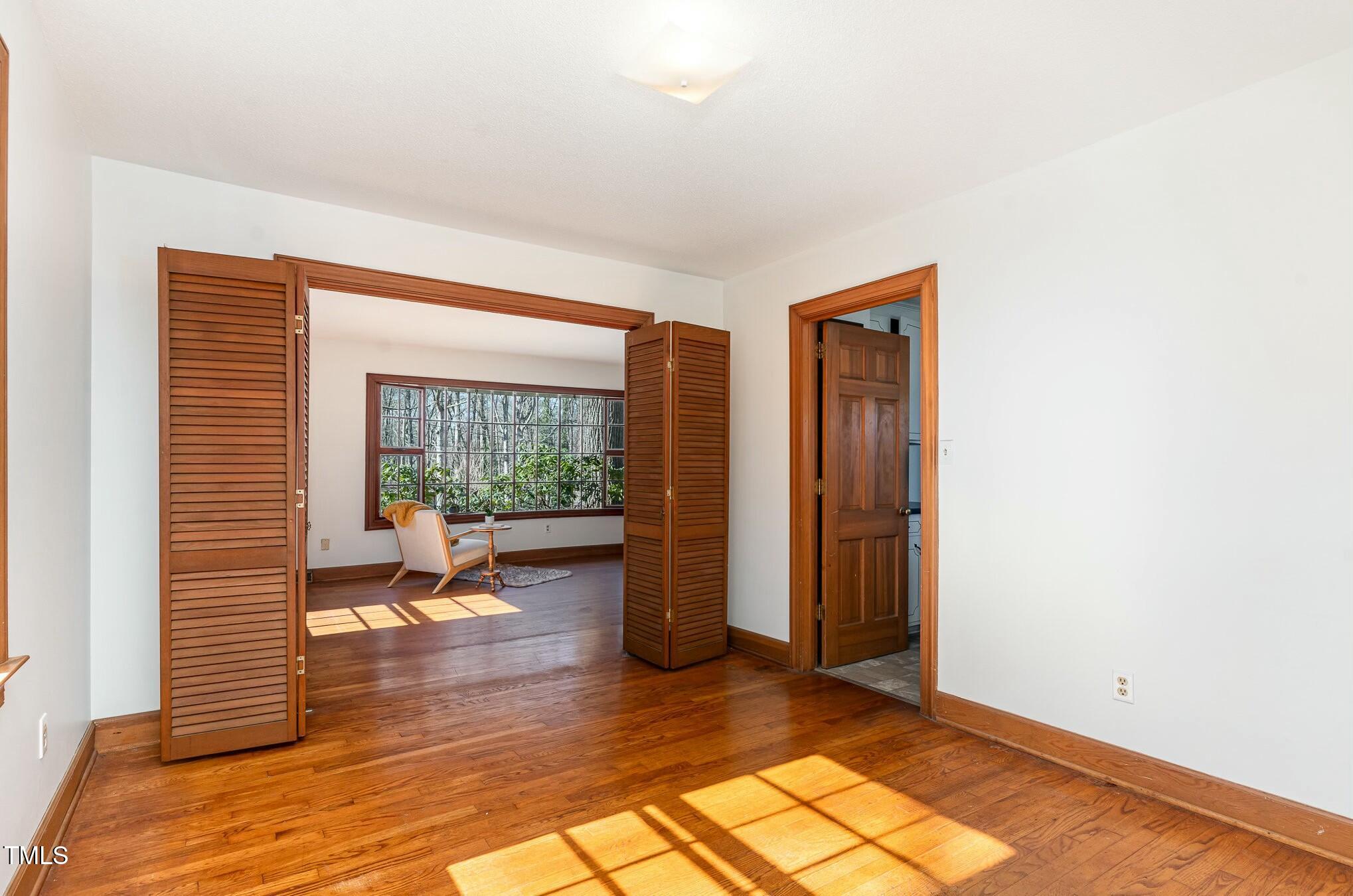 6600 Clinton Place Raleigh, NC 27607 - Photo 11 of 35 a view of a room with wooden floor and a window