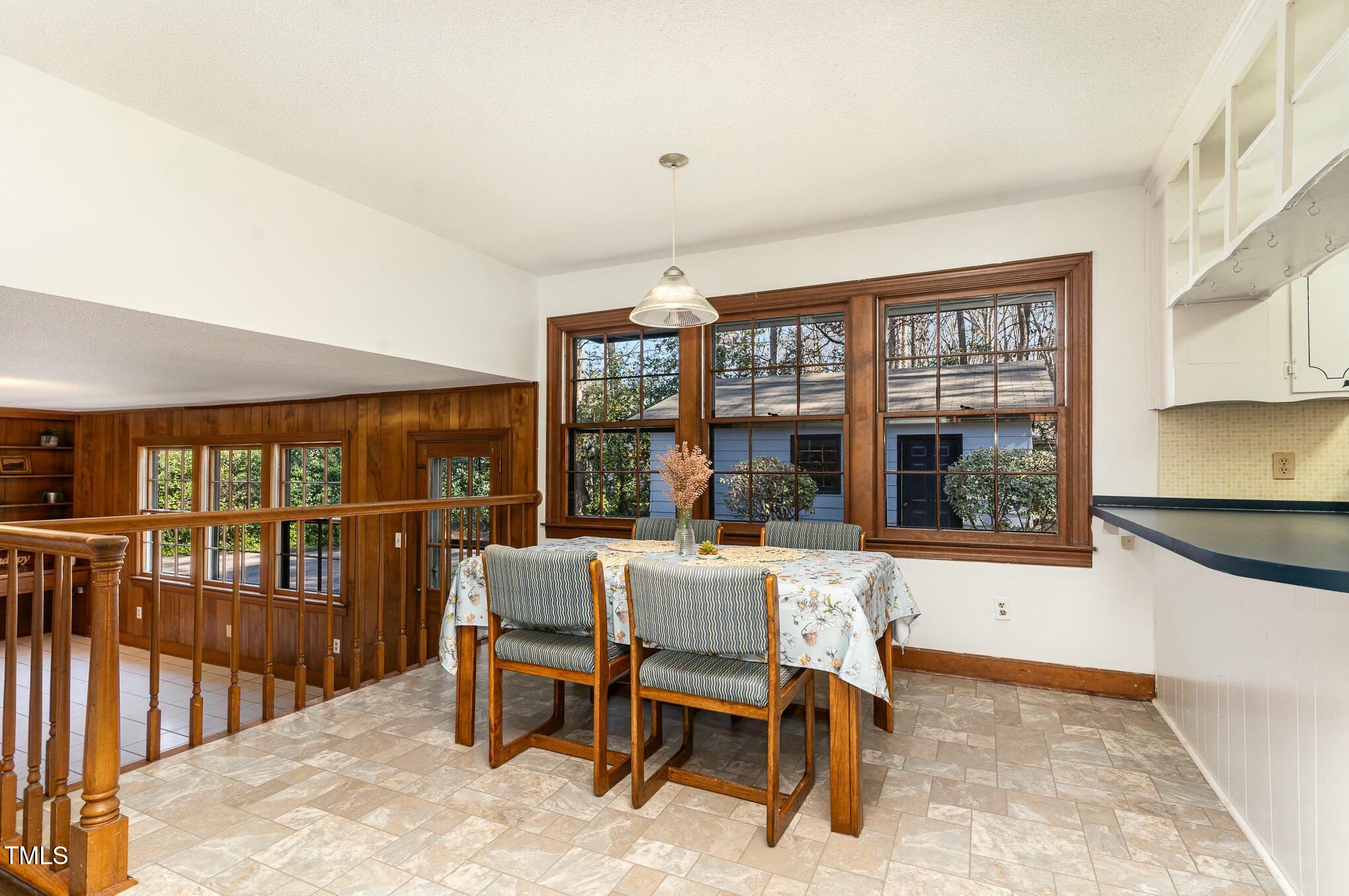 6600 Clinton Place Raleigh, NC 27607 - Photo 14 of 35 a dining room with furniture and large window