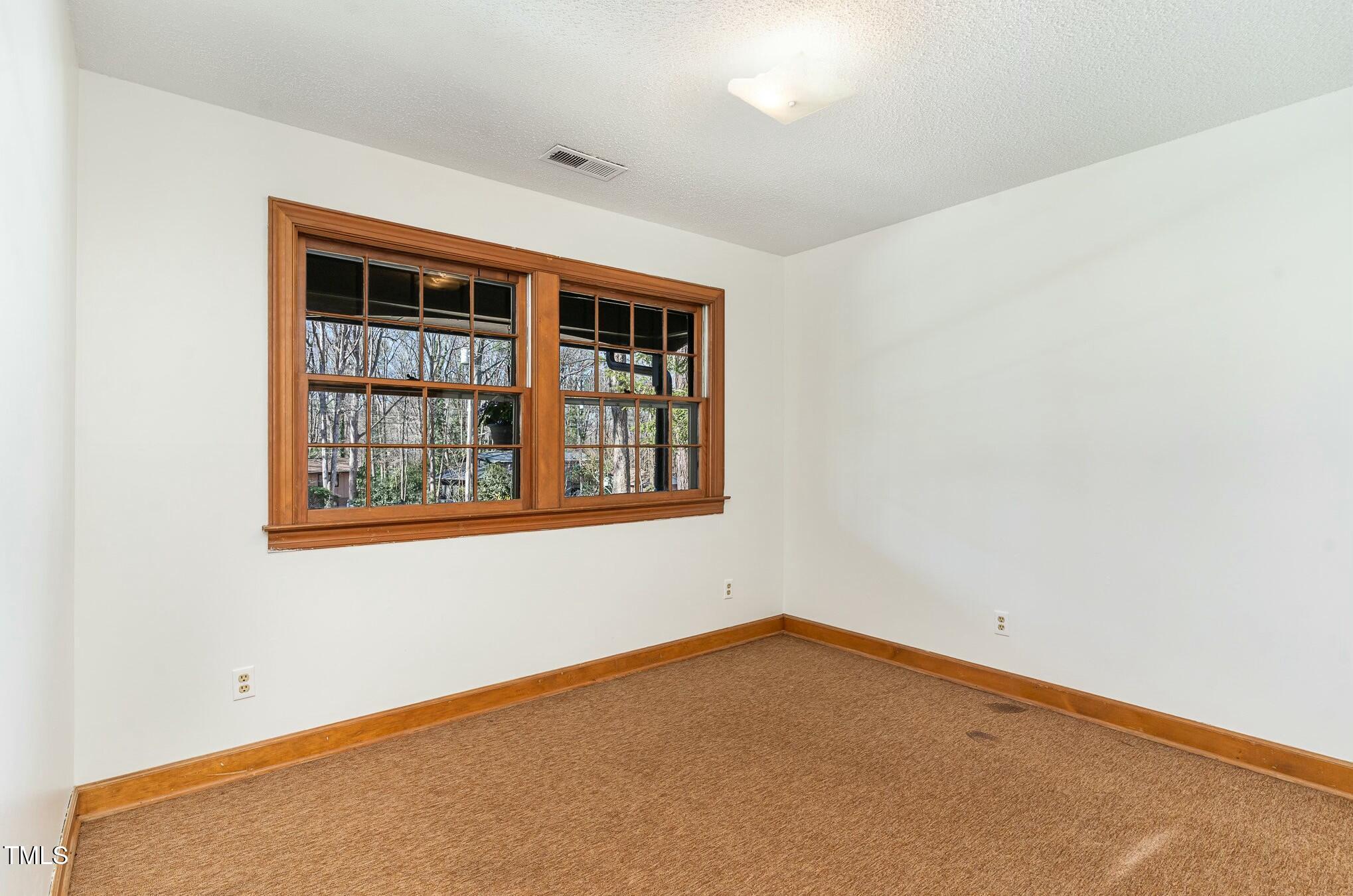 6600 Clinton Place Raleigh, NC 27607 - Photo 16 of 35 an empty room with windows