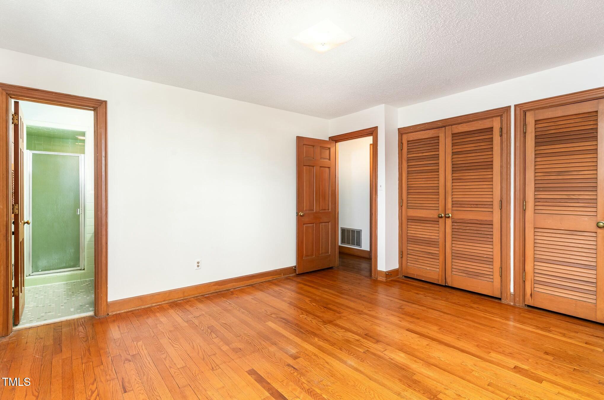 6600 Clinton Place Raleigh, NC 27607 - Photo 22 of 35 an empty room with wooden floor and closet