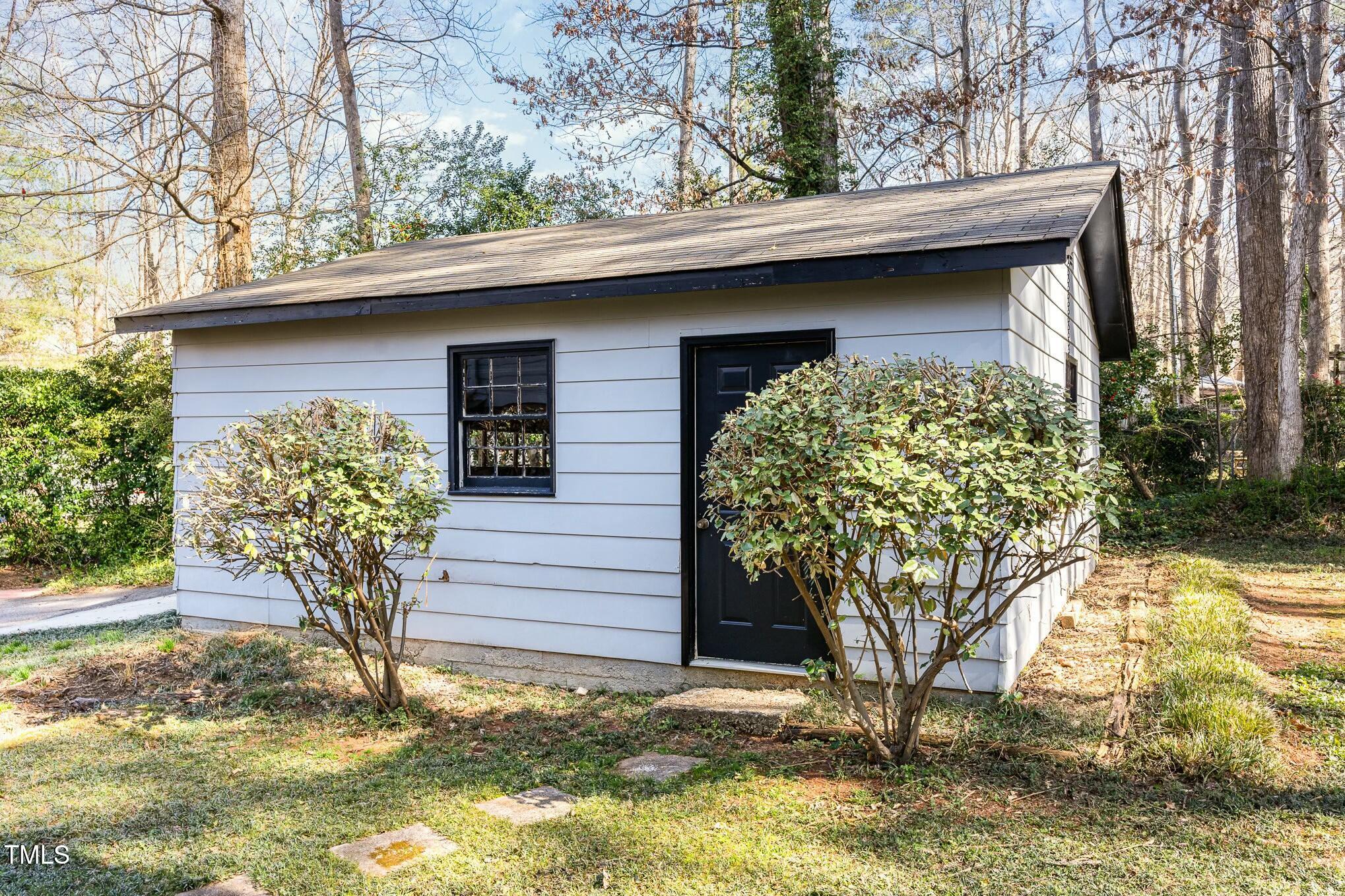 6600 Clinton Place Raleigh, NC 27607 - Photo 24 of 35 a front view of a house with garden