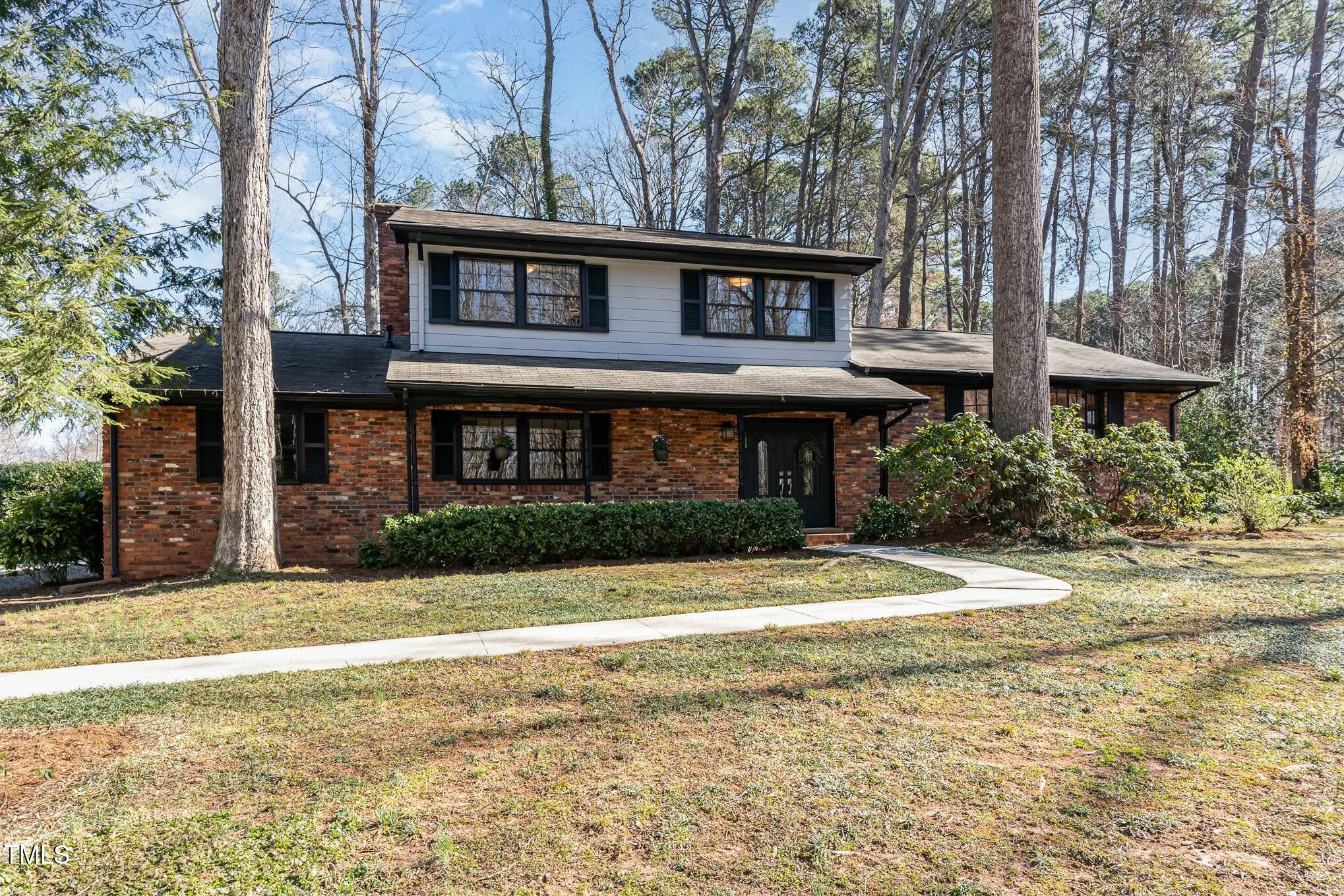 6600 Clinton Place Raleigh, NC 27607 - Photo 27 of 35 a front view of a house with a yard