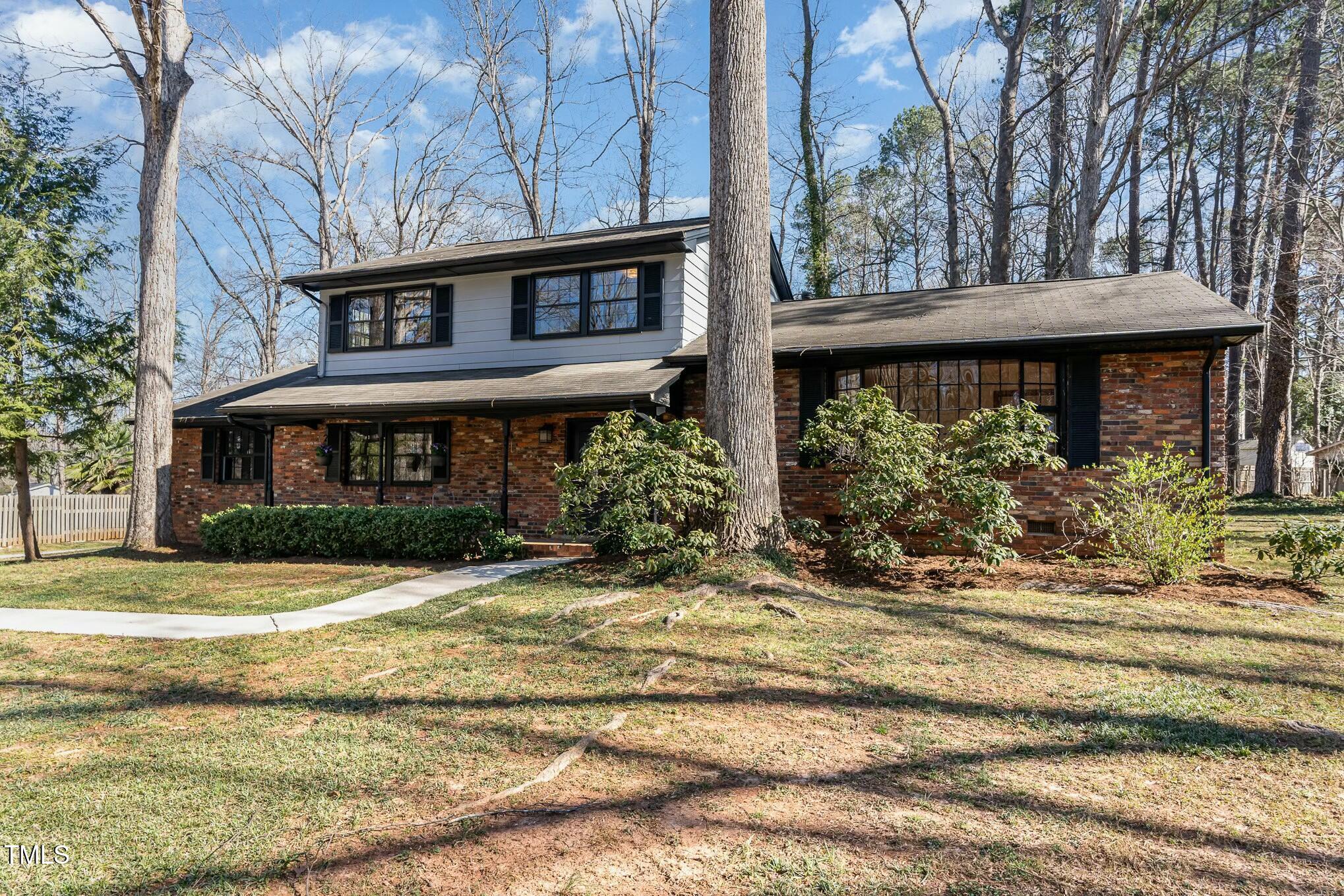 6600 Clinton Place Raleigh, NC 27607 - Photo 28 of 35 a view of a house with a yard and plants