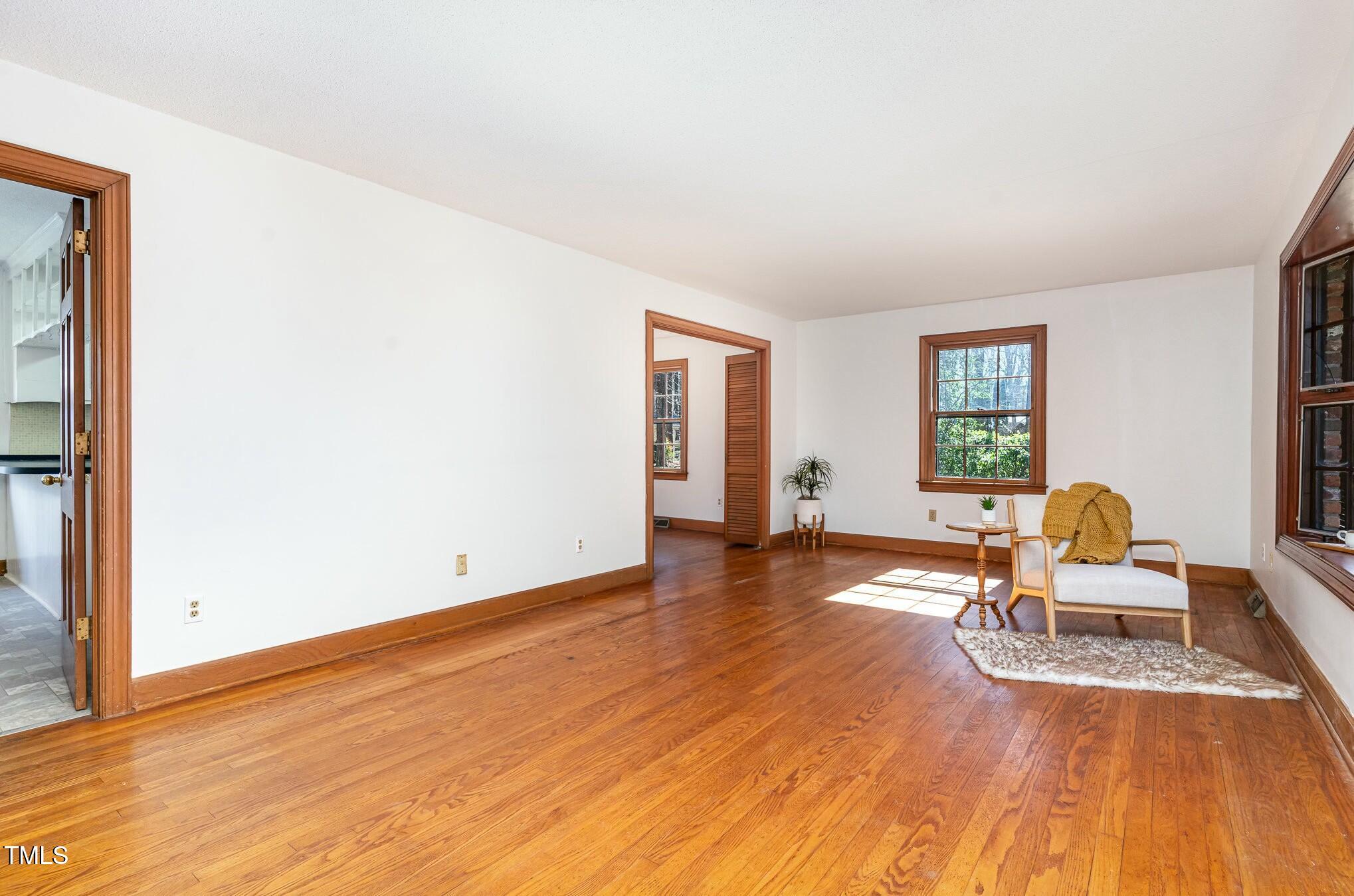 6600 Clinton Place Raleigh, NC 27607 - Photo 6 of 35 a view of a livingroom with wooden floor and furniture