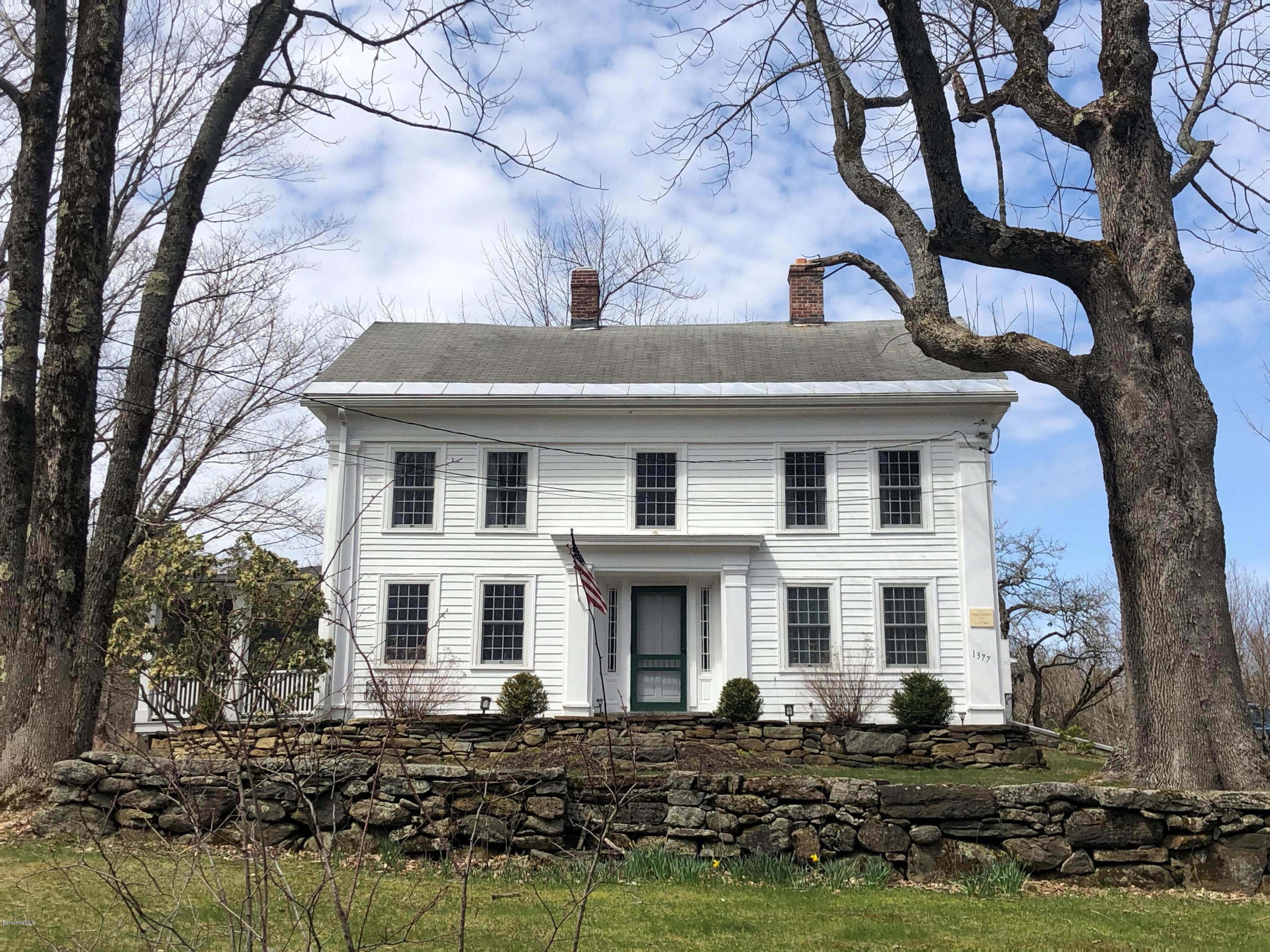1377 Fred Snow Road Becket, MA 01223 - Photo 2 of 34 a front view of a house with a yard
