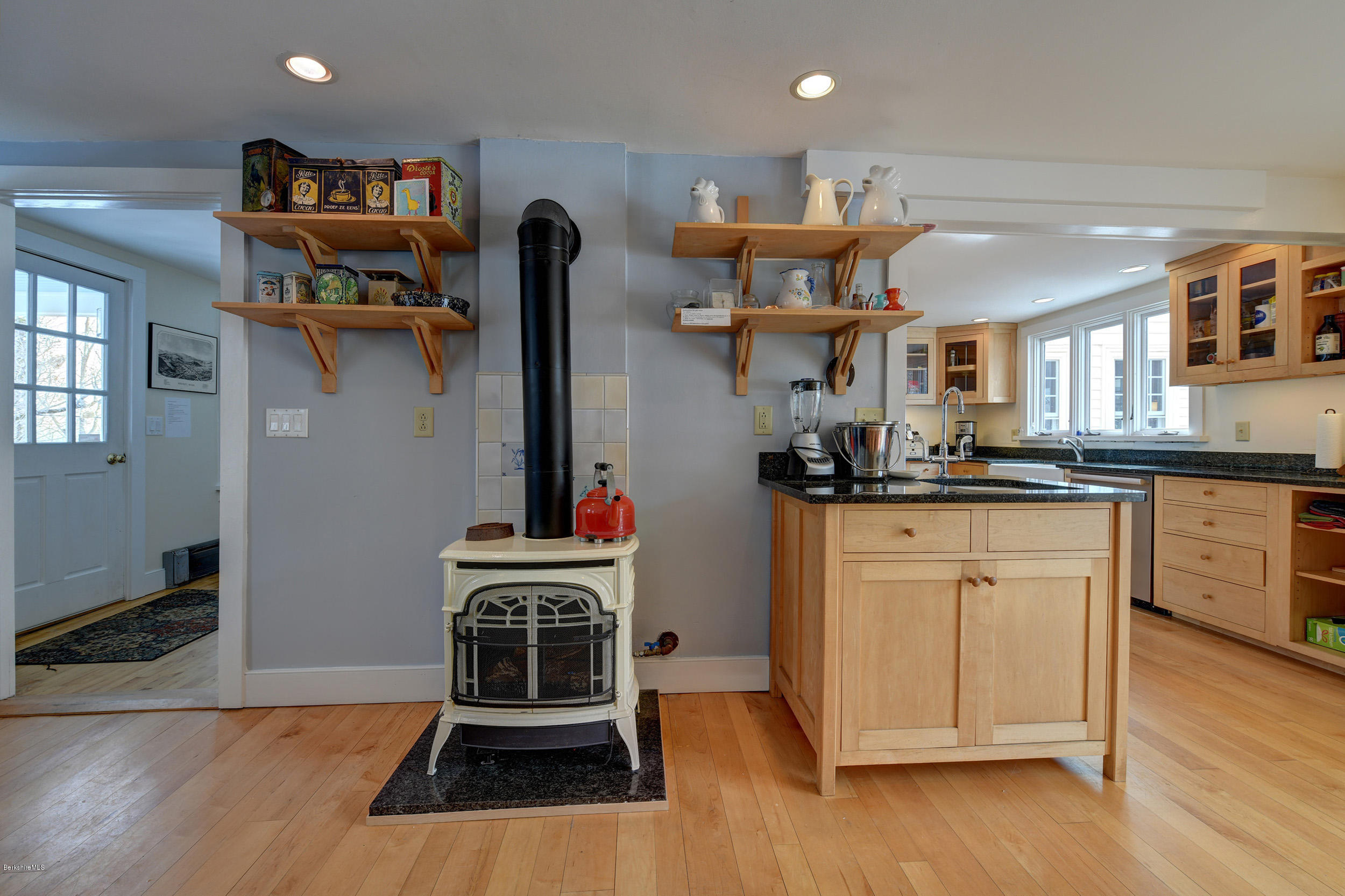 1377 Fred Snow Road Becket, MA 01223 - Photo 11 of 34 a kitchen with stainless steel appliances granite countertop a refrigerator a stove and a wooden floors