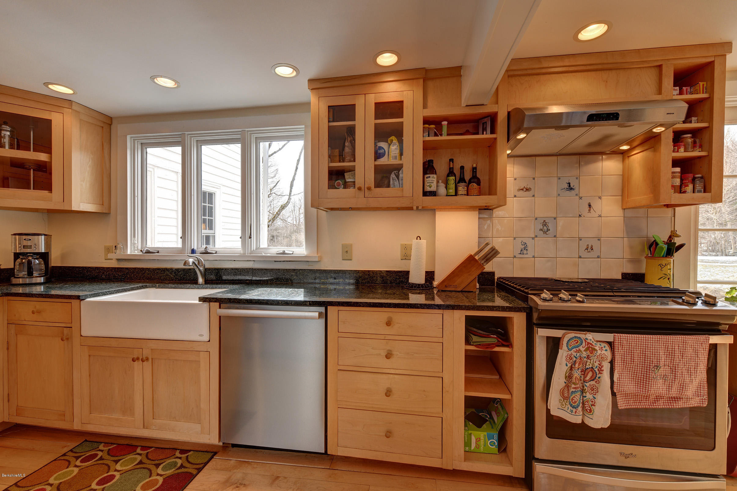 1377 Fred Snow Road Becket, MA 01223 - Photo 14 of 34 a kitchen with granite countertop a sink and cabinets