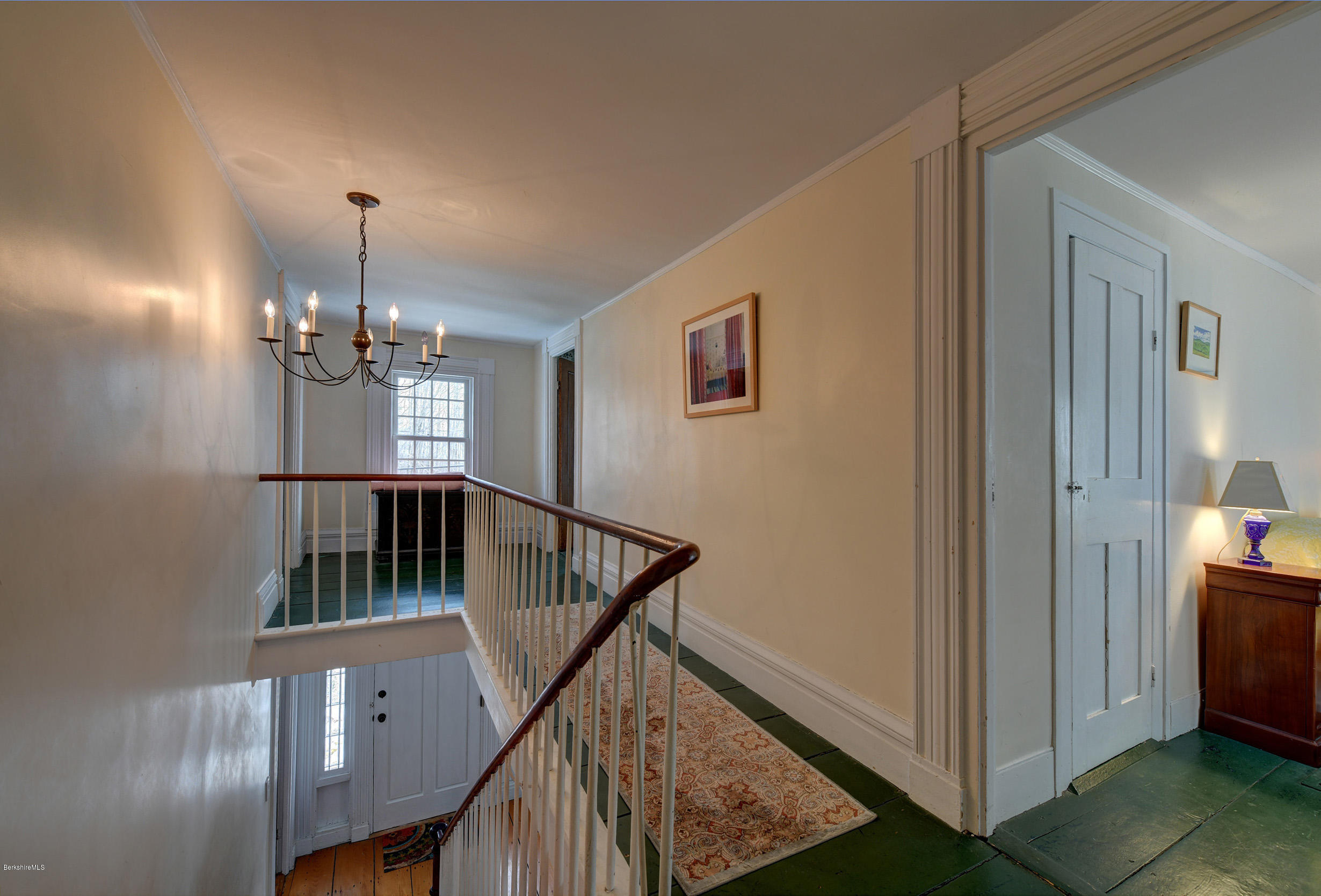 1377 Fred Snow Road Becket, MA 01223 - Photo 21 of 34 a view of a hallway with windows and chandelier