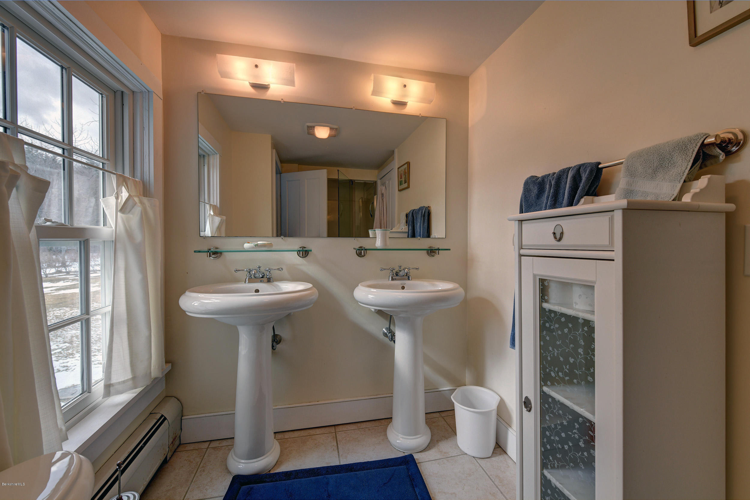 1377 Fred Snow Road Becket, MA 01223 - Photo 24 of 34 a bathroom with a sink toilet and a mirror