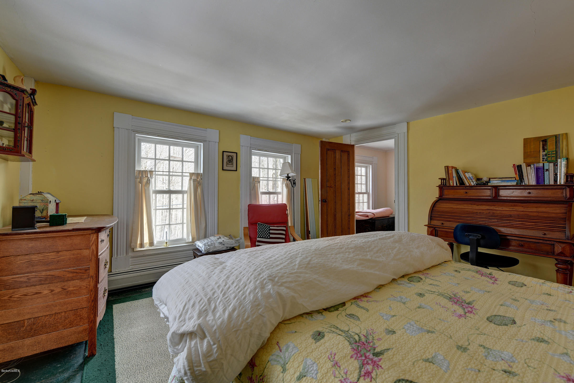 1377 Fred Snow Road Becket, MA 01223 - Photo 25 of 34 a bedroom with a bed and wooden floor