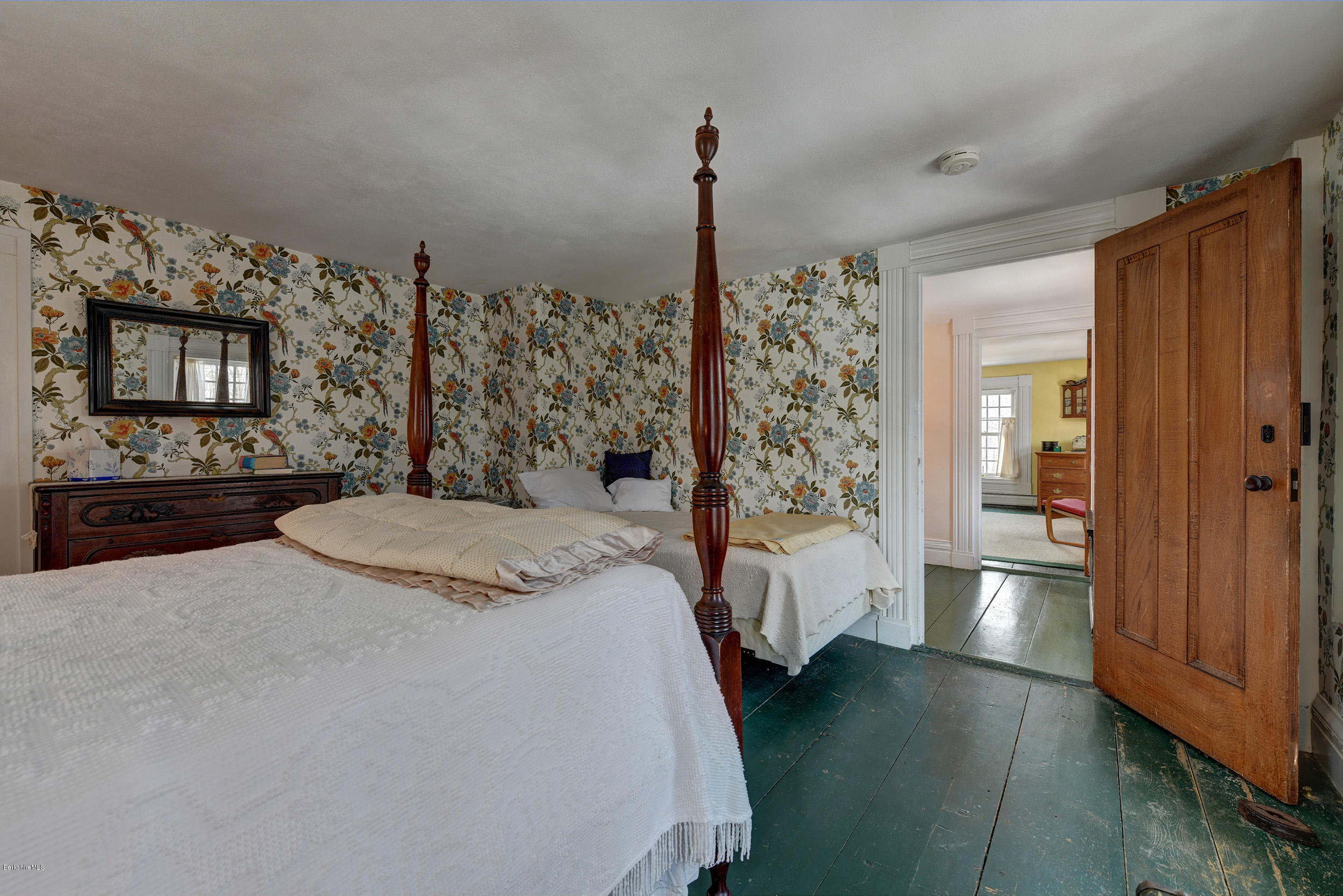 1377 Fred Snow Road Becket, MA 01223 - Photo 27 of 34 a spacious bedroom with a bed and a dresser