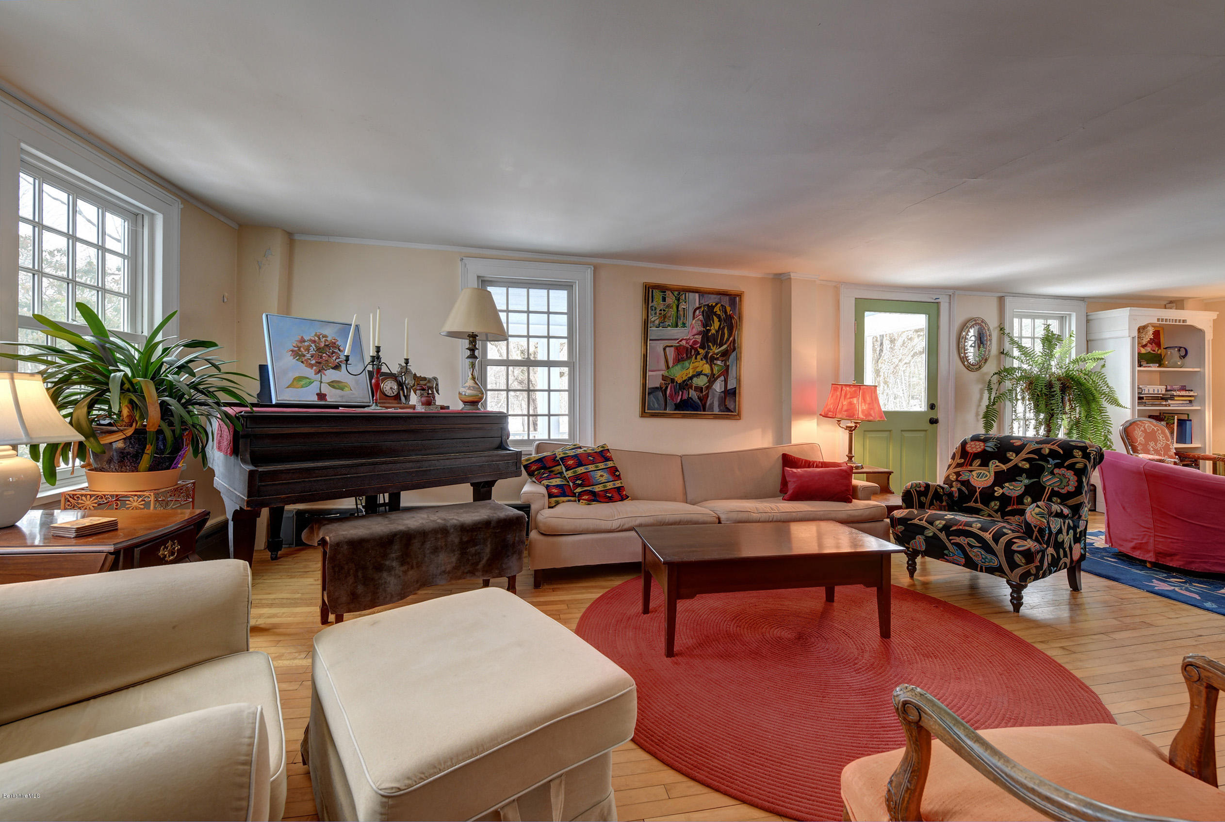 1377 Fred Snow Road Becket, MA 01223 - Photo 7 of 34 a living room with furniture a piano and a potted plant
