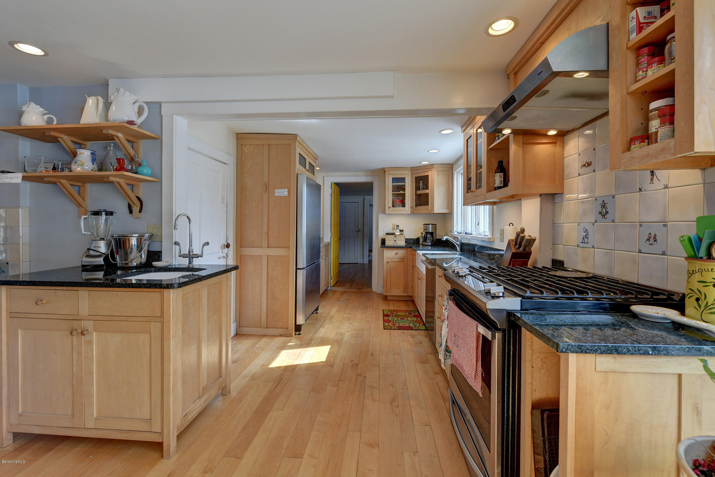 1377 Fred Snow Road Becket, MA 01223 - Photo 10 of 34 a kitchen with stainless steel appliances granite countertop a stove and a sink