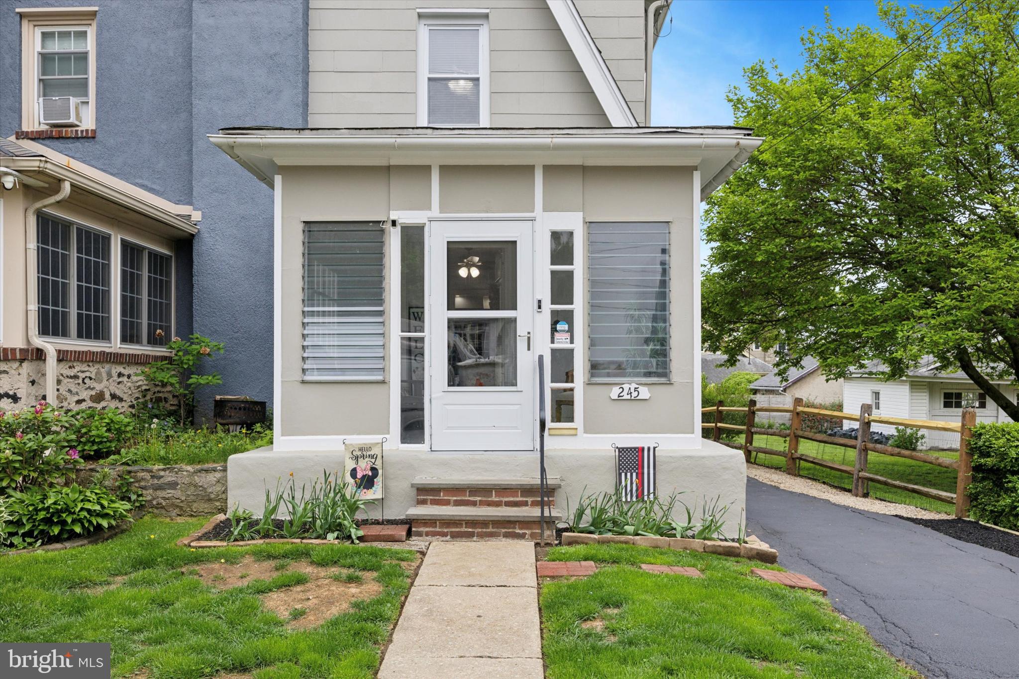 245 Sagamore Road Havertown, PA 19083 - Photo 3 of 31 a front view of a house with a garden and yard