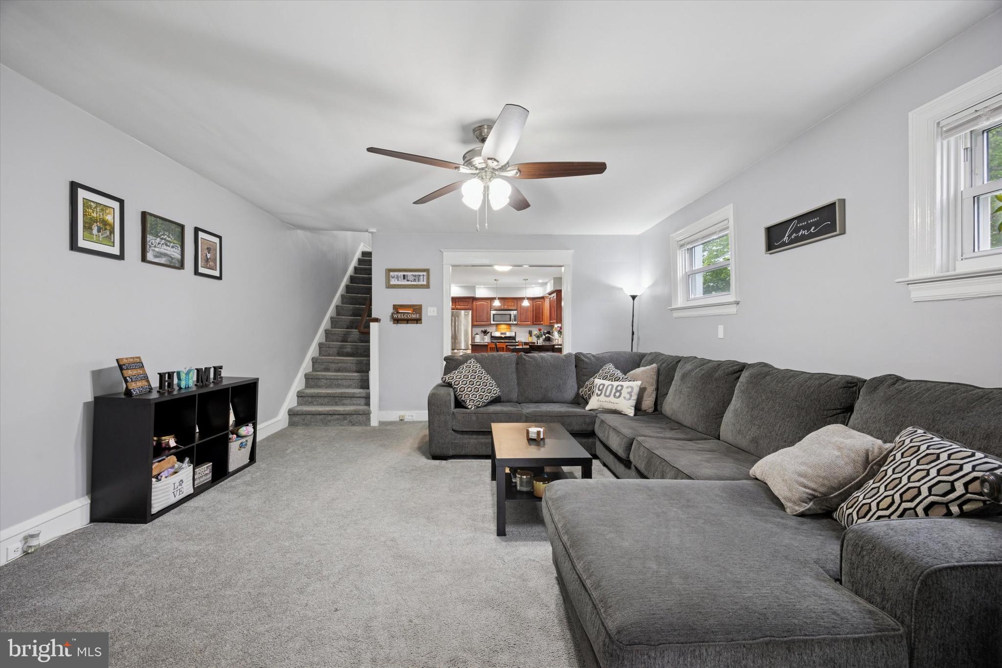 245 Sagamore Road Havertown, PA 19083 - Photo 6 of 31 a living room with furniture and a chandelier