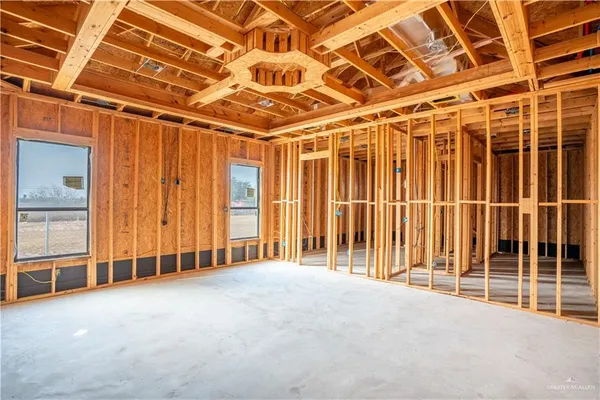 a view of an empty room with wooden walls