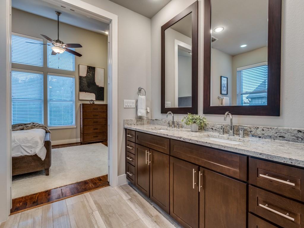 4211 Rawlins Street, Unit 97 Dallas, TX 75219 - Photo 14 of 24 a bathroom with a sink and a mirror