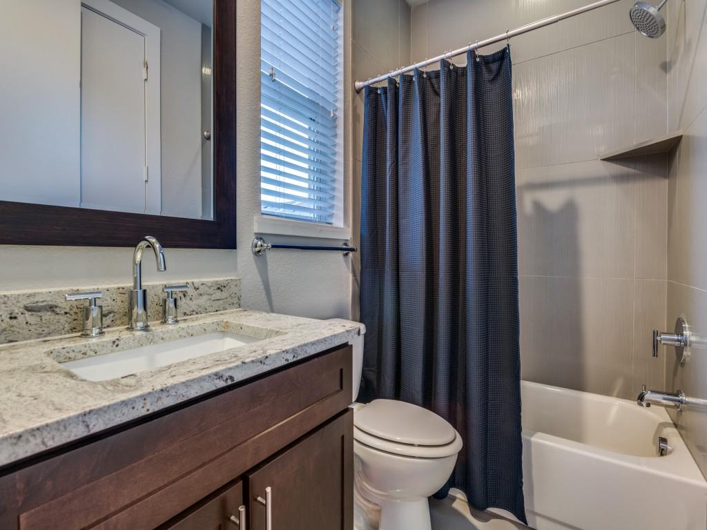 4211 Rawlins Street, Unit 97 Dallas, TX 75219 - Photo 19 of 24 a bathroom with a granite countertop sink toilet and shower