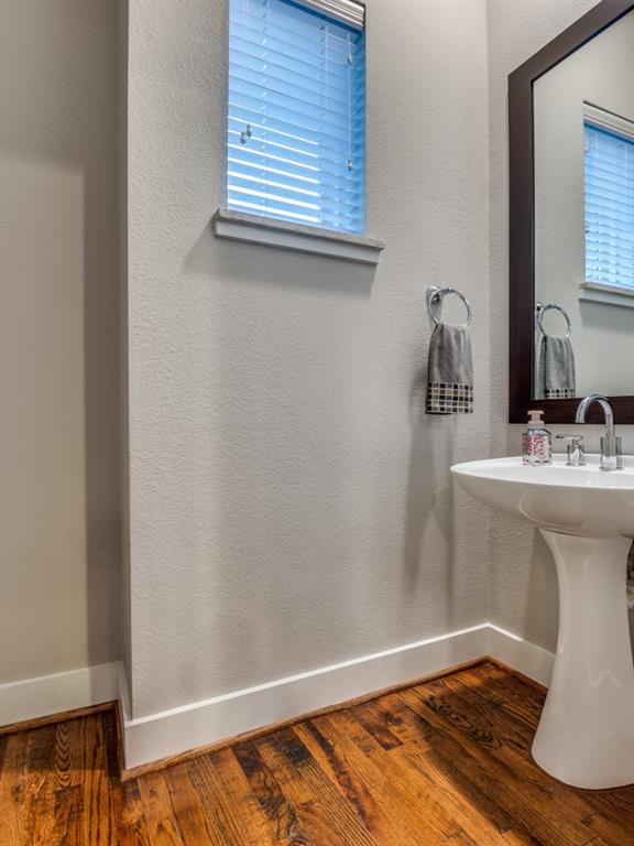 4211 Rawlins Street, Unit 97 Dallas, TX 75219 - Photo 20 of 24 a bathroom with a sink and a mirror