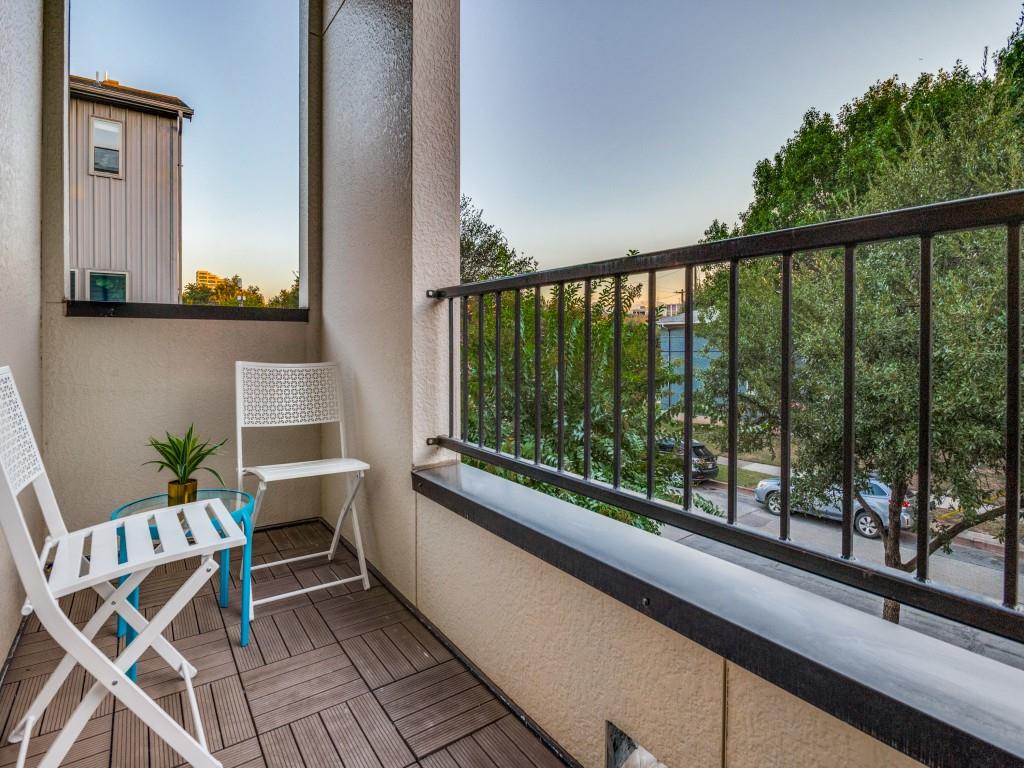 4211 Rawlins Street, Unit 97 Dallas, TX 75219 - Photo 23 of 24 a view of balcony with wooden floor and outdoor seating
