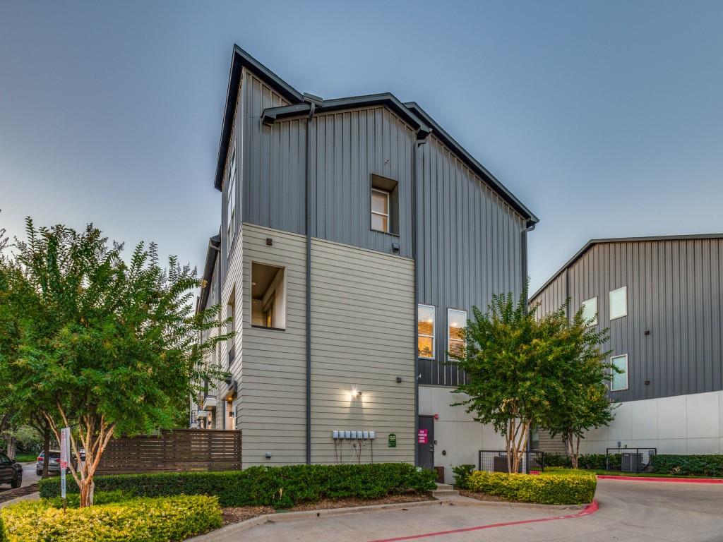 4211 Rawlins Street, Unit 97 Dallas, TX 75219 - Photo 24 of 24 a front view of a house with a yard and garage