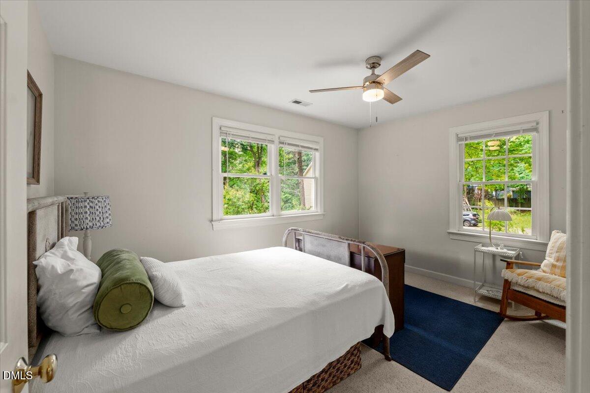 109 Hemingway Forest Place Raleigh, NC 27607 - Photo 21 of 33 a bedroom with a bed and a window