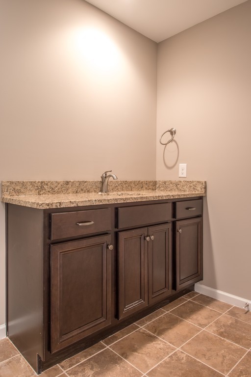 942 Hunters Lane Springfield, TN 37172 - Photo 29 of 40 a bathroom with a granite countertop sink and a mirror