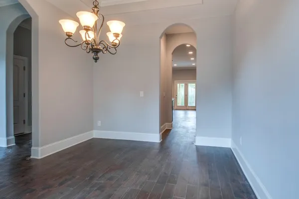 a view of a livingroom with wooden floor