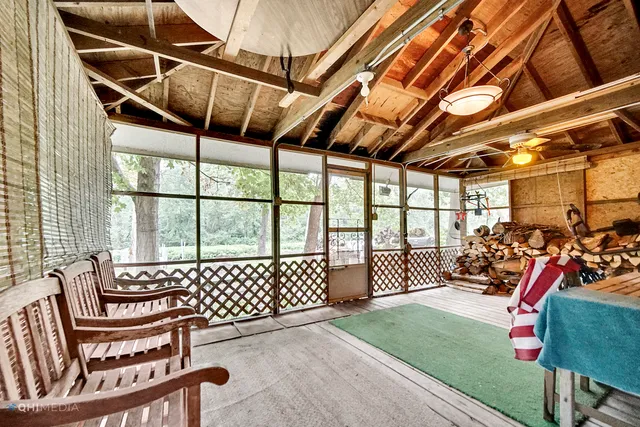 a view of a chairs and table in a patio