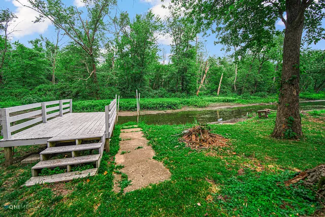 a view of a lake with green space