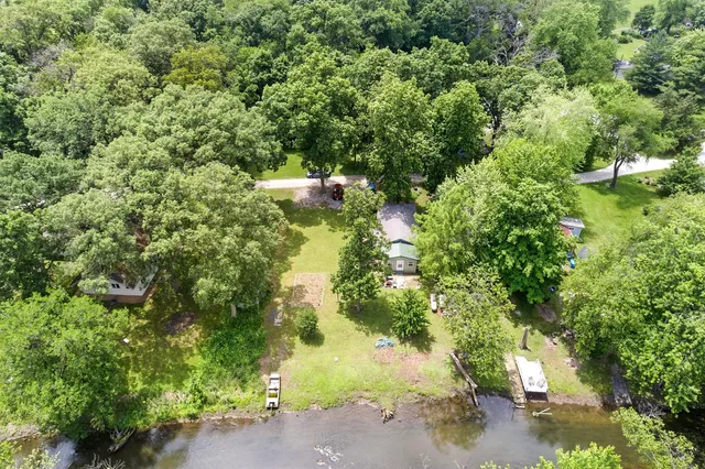 a view of a house with a tree