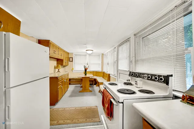a kitchen that has a sink and a refrigerator