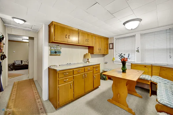 a kitchen with sink and cabinets
