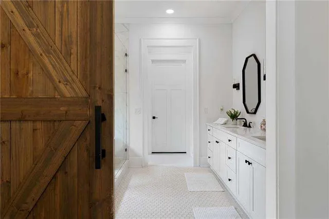 a bathroom with mirror sink and window