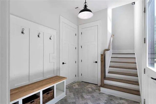 a room with a bed and a ceiling fan