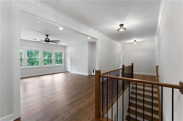 a view of an entryway with wooden floor