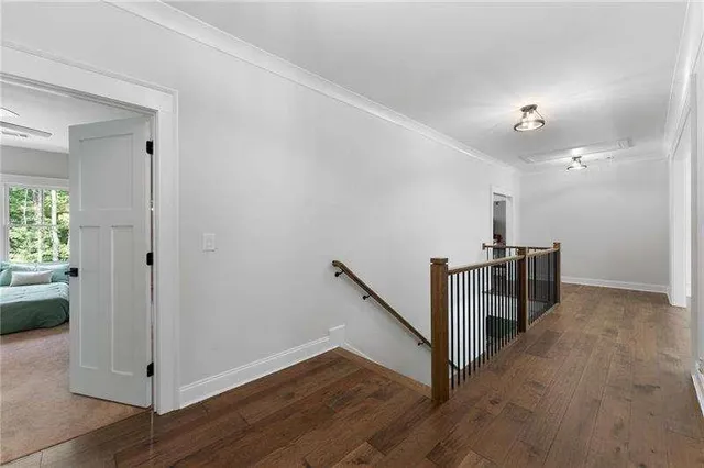 a view of a hallway with a hardwood floor