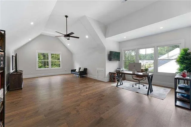 a view of a livingroom with furniture and a window
