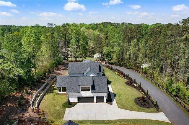 an aerial view of a house with a garden