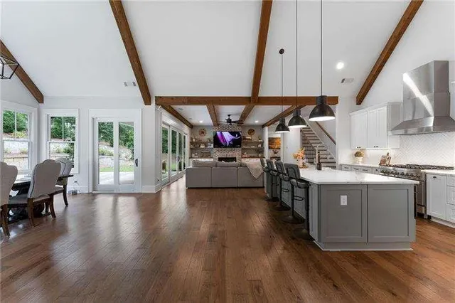 a kitchen with sink cabinets and wooden floor