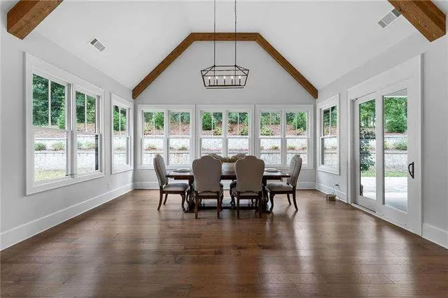 a view of a dining room with furniture window and wooden floor