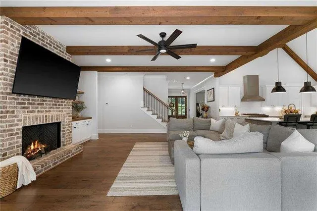 a living room with furniture and a fireplace