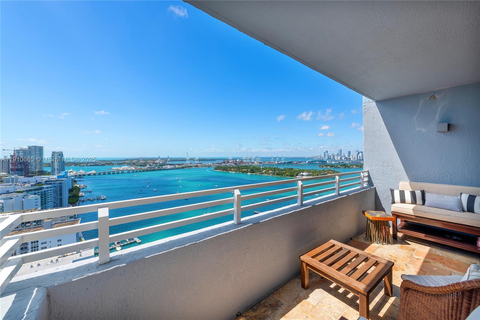 1330 West Avenue, Unit 3104 Miami Beach, FL 33139 - Photo 5 of 18 a view of balcony with two chairs and a table