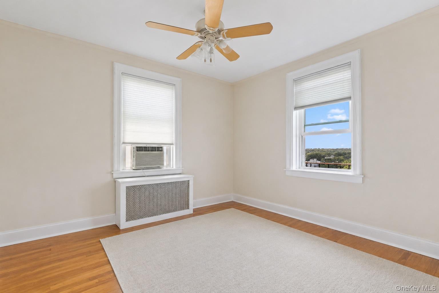 54 Sagamore Road, Unit 4E Bronxville, NY 10708 - Photo 8 of 10 an empty room with windows and cabinet