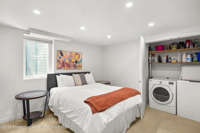 a bedroom with a bed and a cabinets