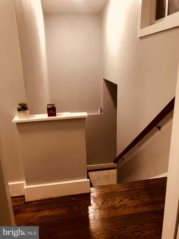 a view of entryway with wooden floor