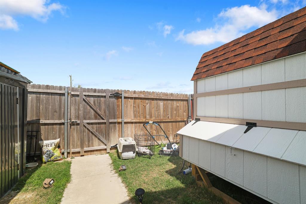 1445 Sterling Way Ferris, TX 75125 - Photo 15 of 17 a view of a patio with table and chairs