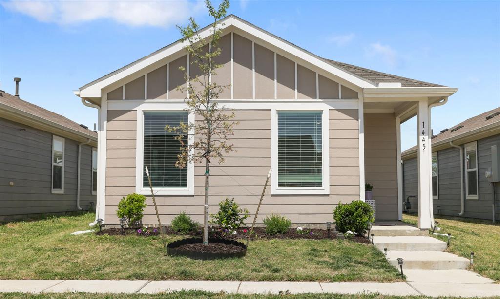 1445 Sterling Way Ferris, TX 75125 - Photo 17 of 17 a front view of a house with garden
