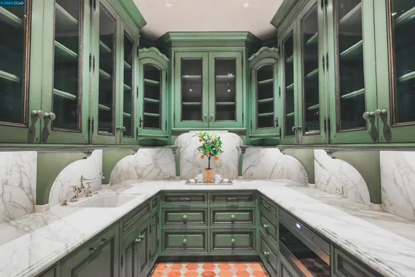 a kitchen with stainless steel appliances a sink and a refrigerator