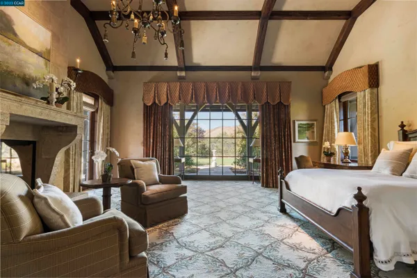 a bed room with a bed and a large window